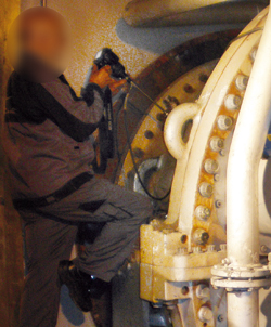 Gas turbine being inspected for damage by a boroscope (endoscope)